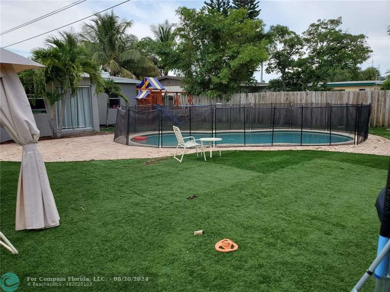 a view of a backyard with a small cabin