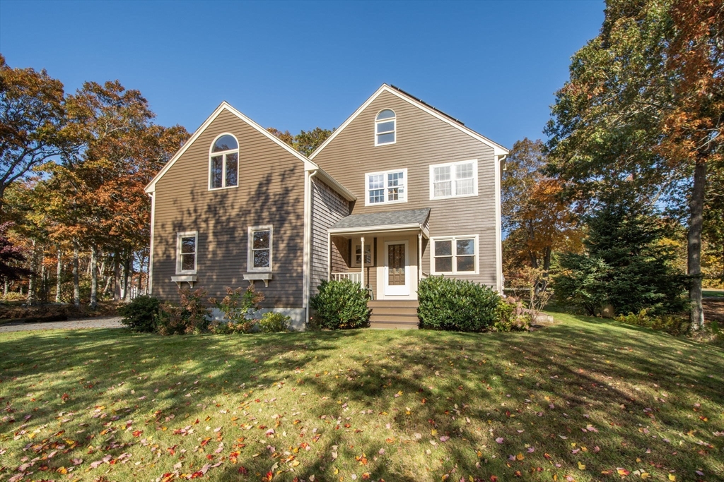 a front view of a house with a yard