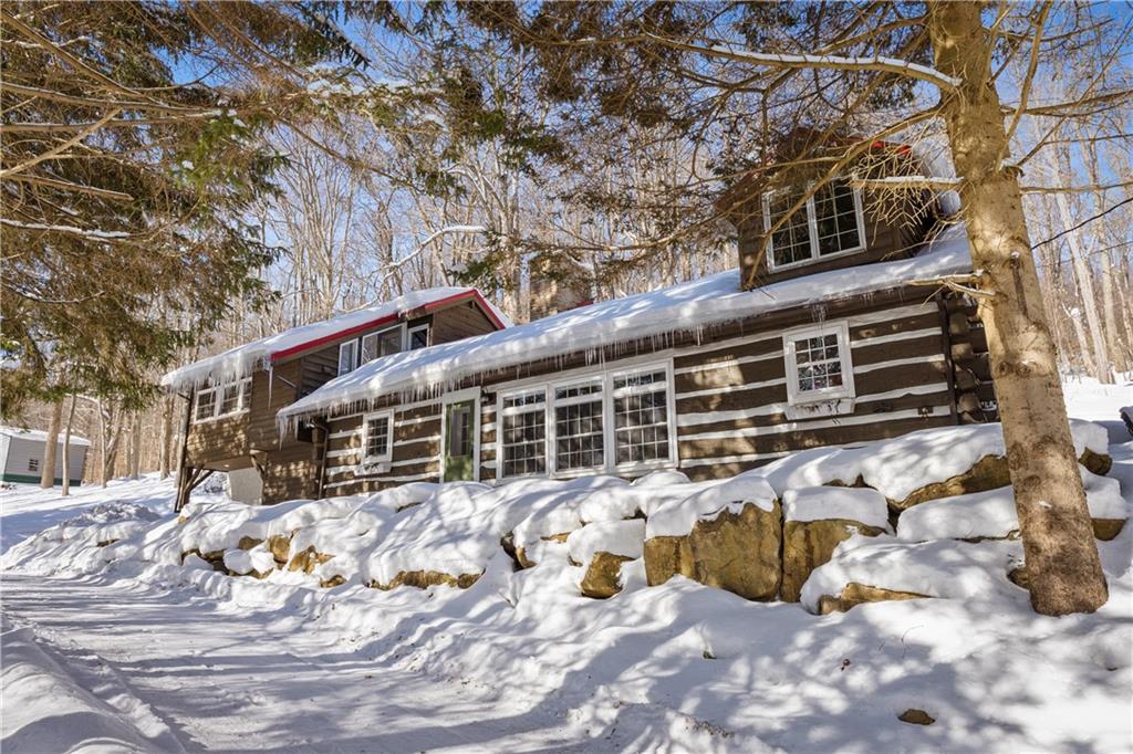 a view of a house with snow in the yard