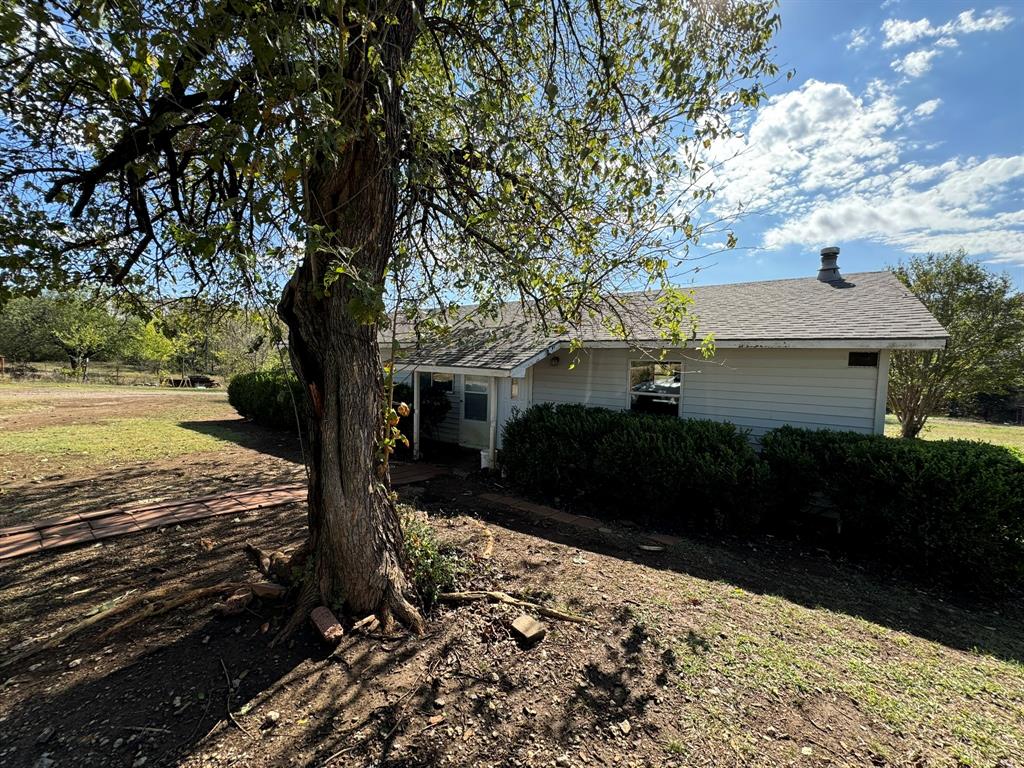 a view of a backyard of the house