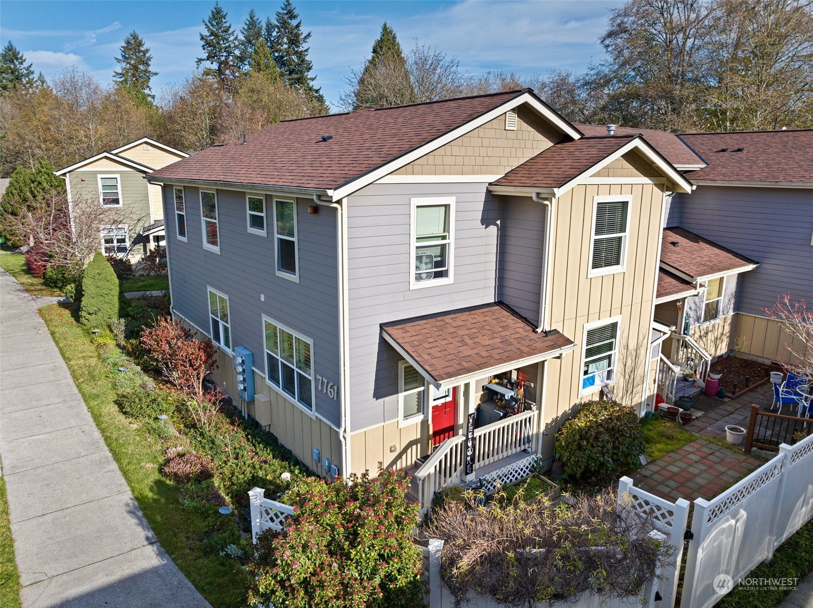 a aerial view of a house with a yard