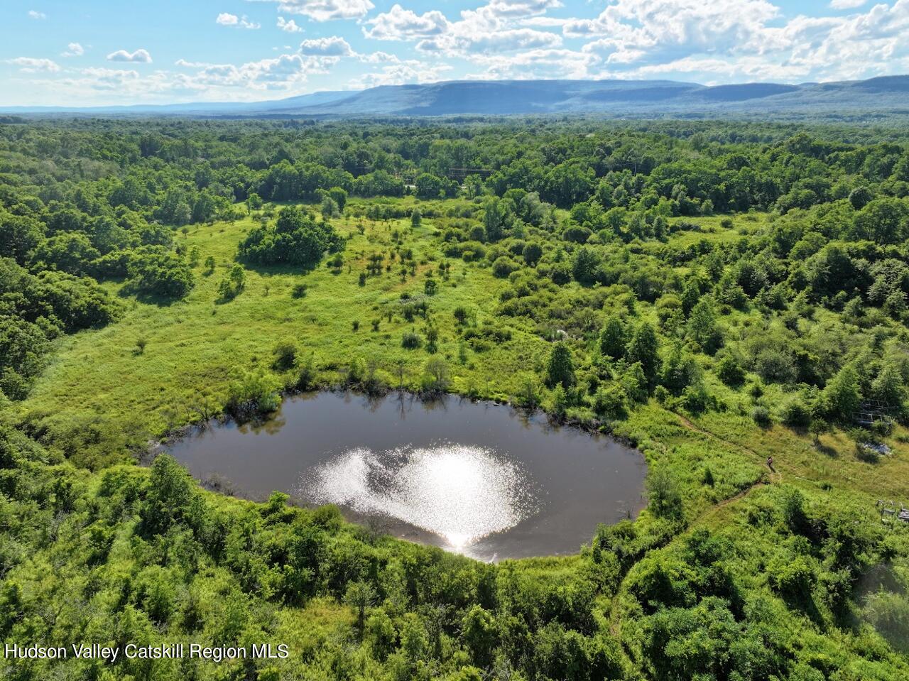 a view of a lake with a yard