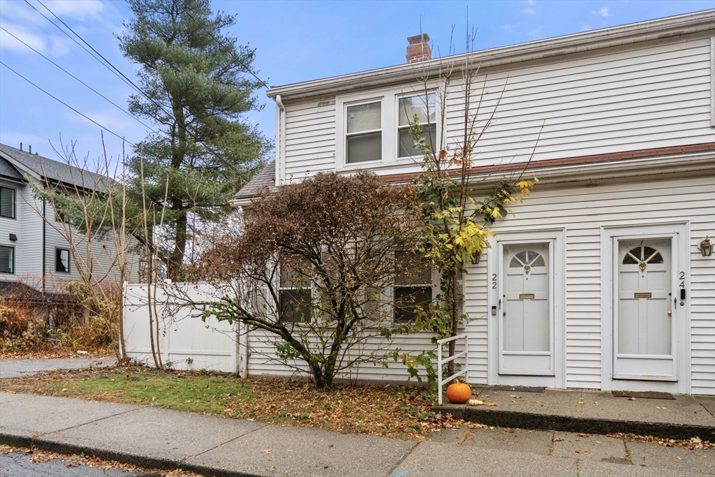 a view of a house with a small garden