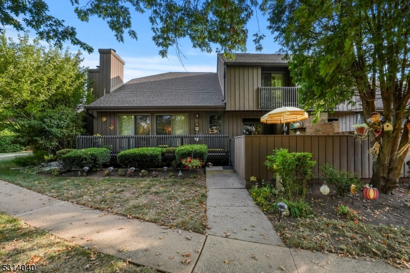 a view of a house with a yard and plants