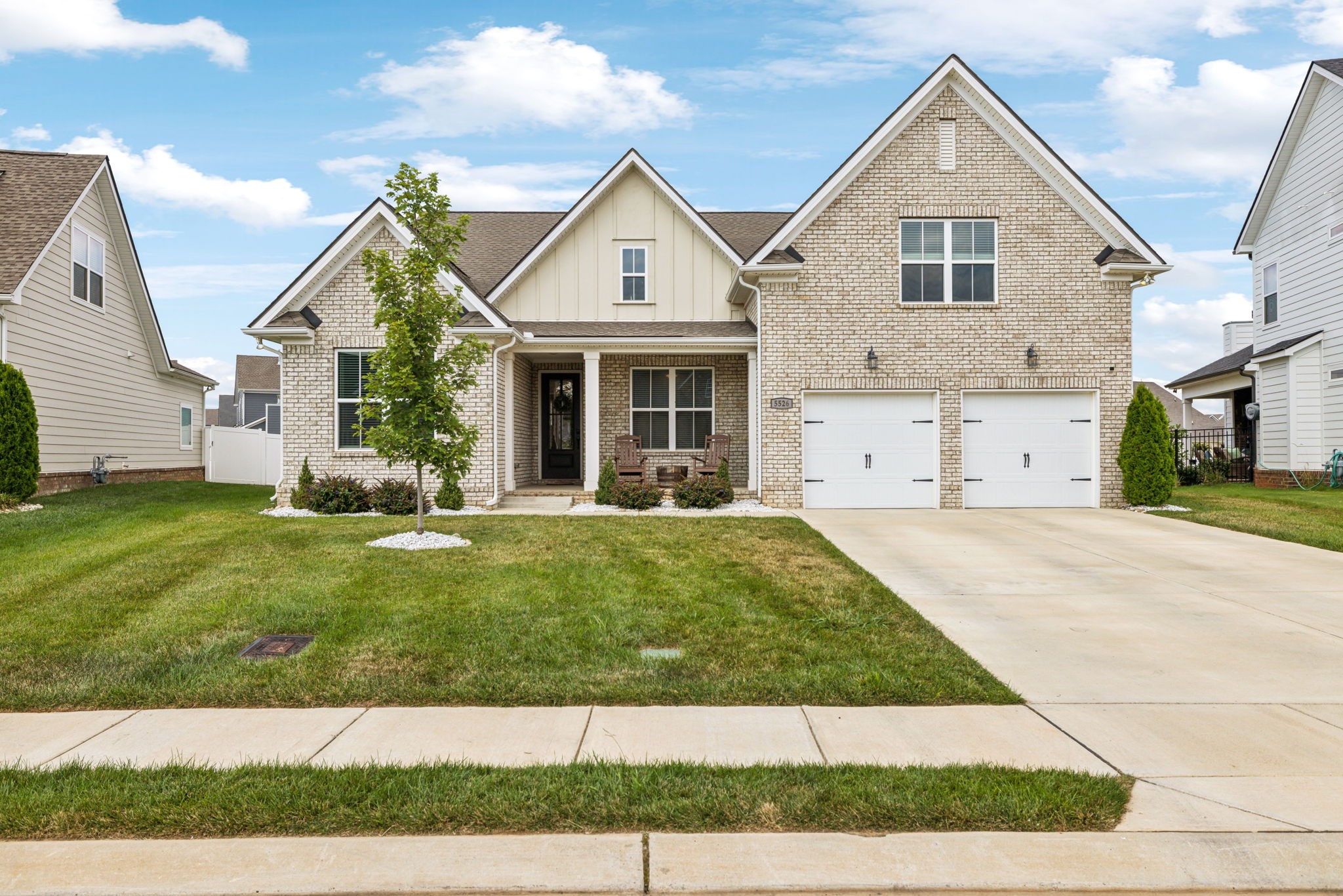 a view of a yard in front view of a house