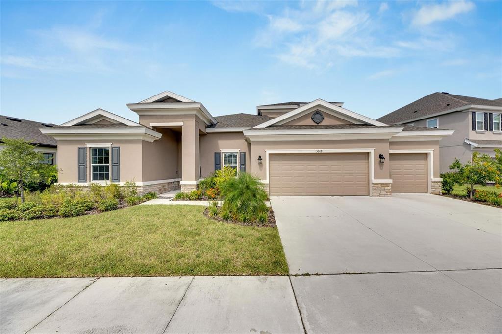 front view of a house with a yard