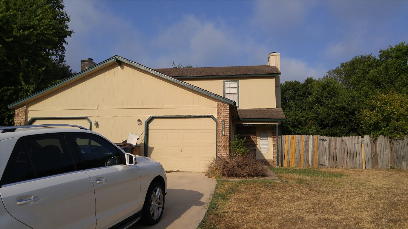 a view of a house with a garage