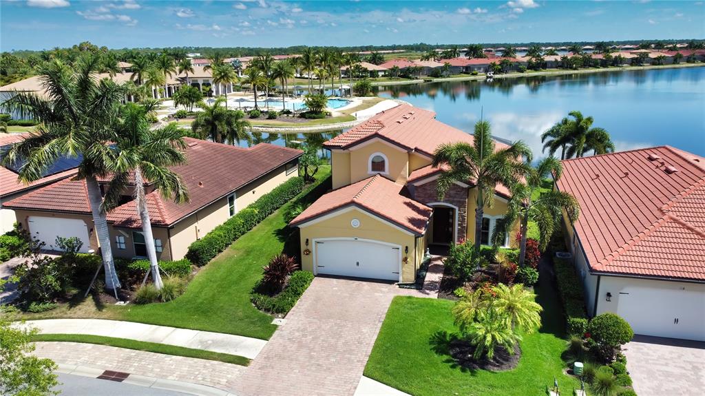 an aerial view of a house with a lake view