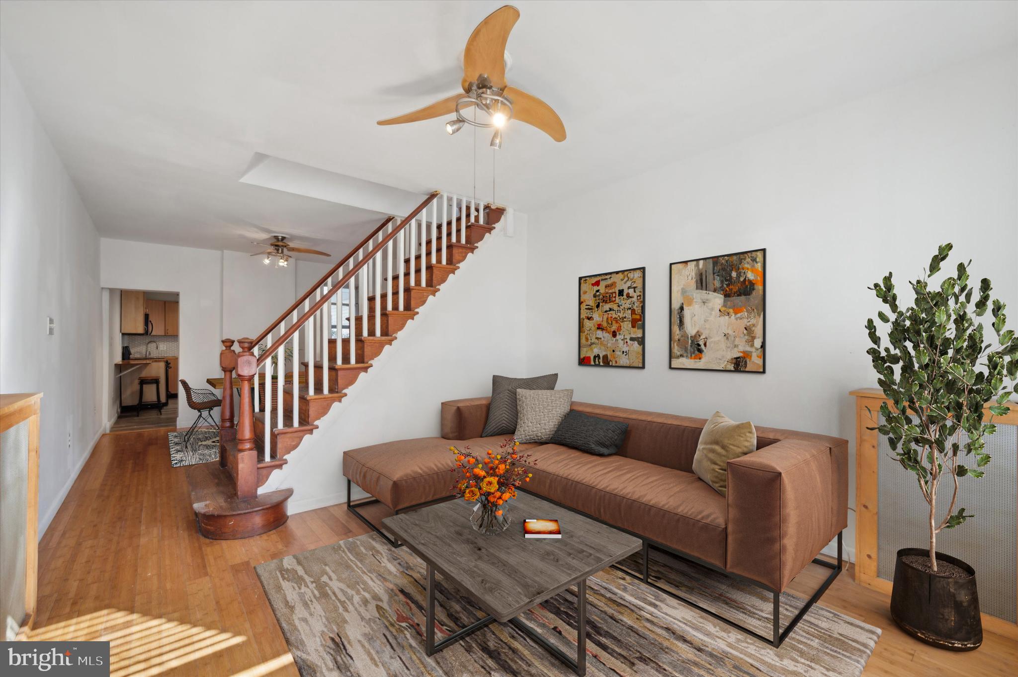 a living room with furniture or wooden floor and a chandelier