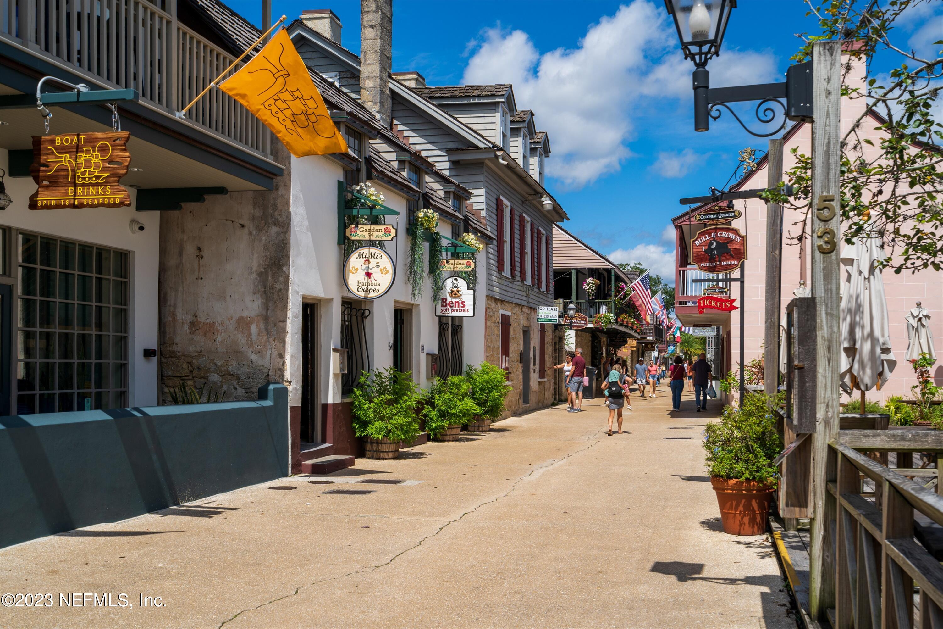 a view of shops on a street