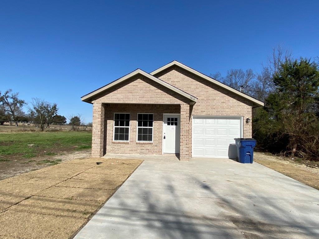 a front view of a house with yard