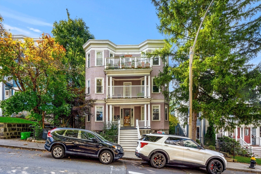 a car parked in front of a house