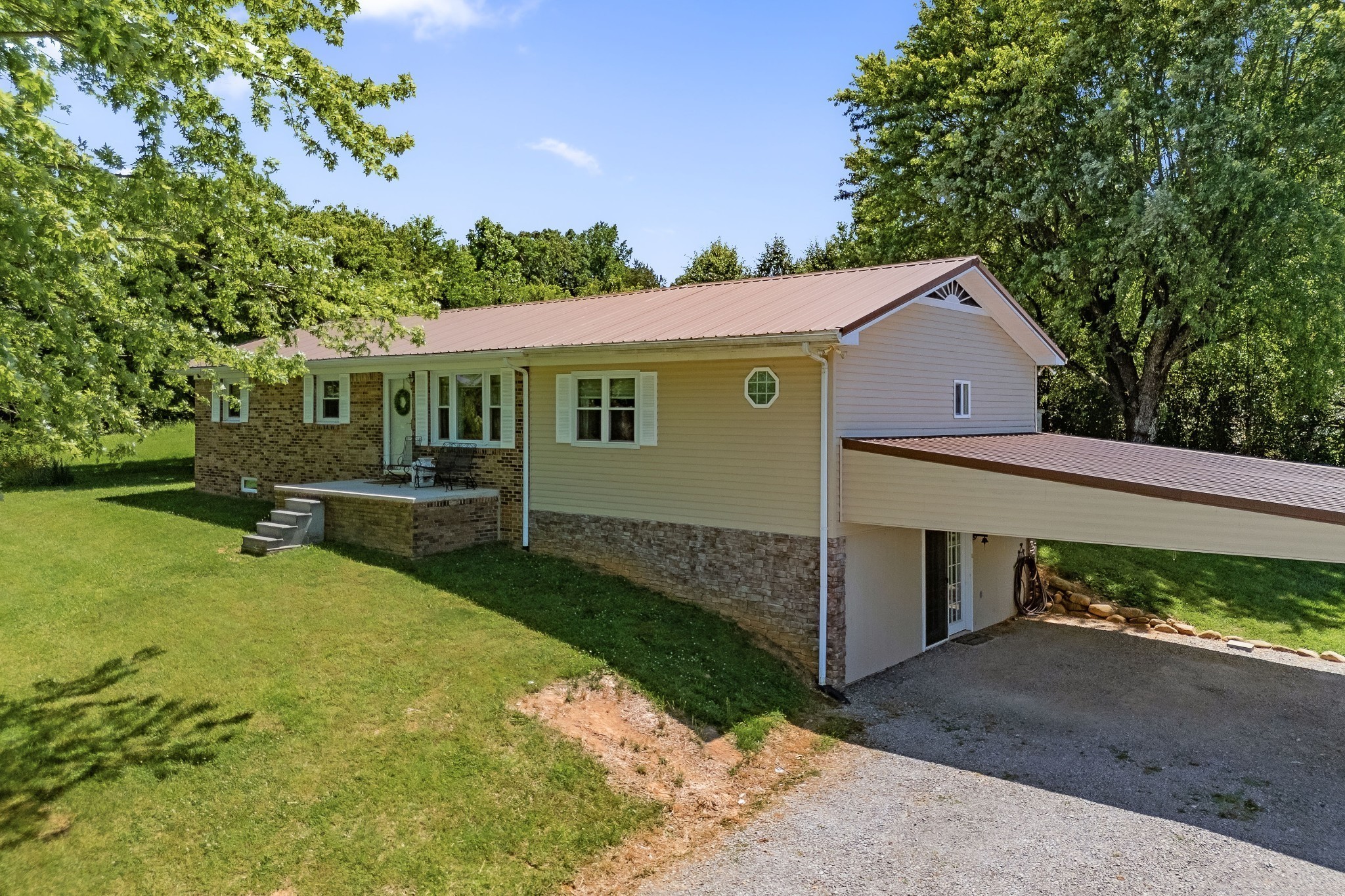 a front view of a house with garden