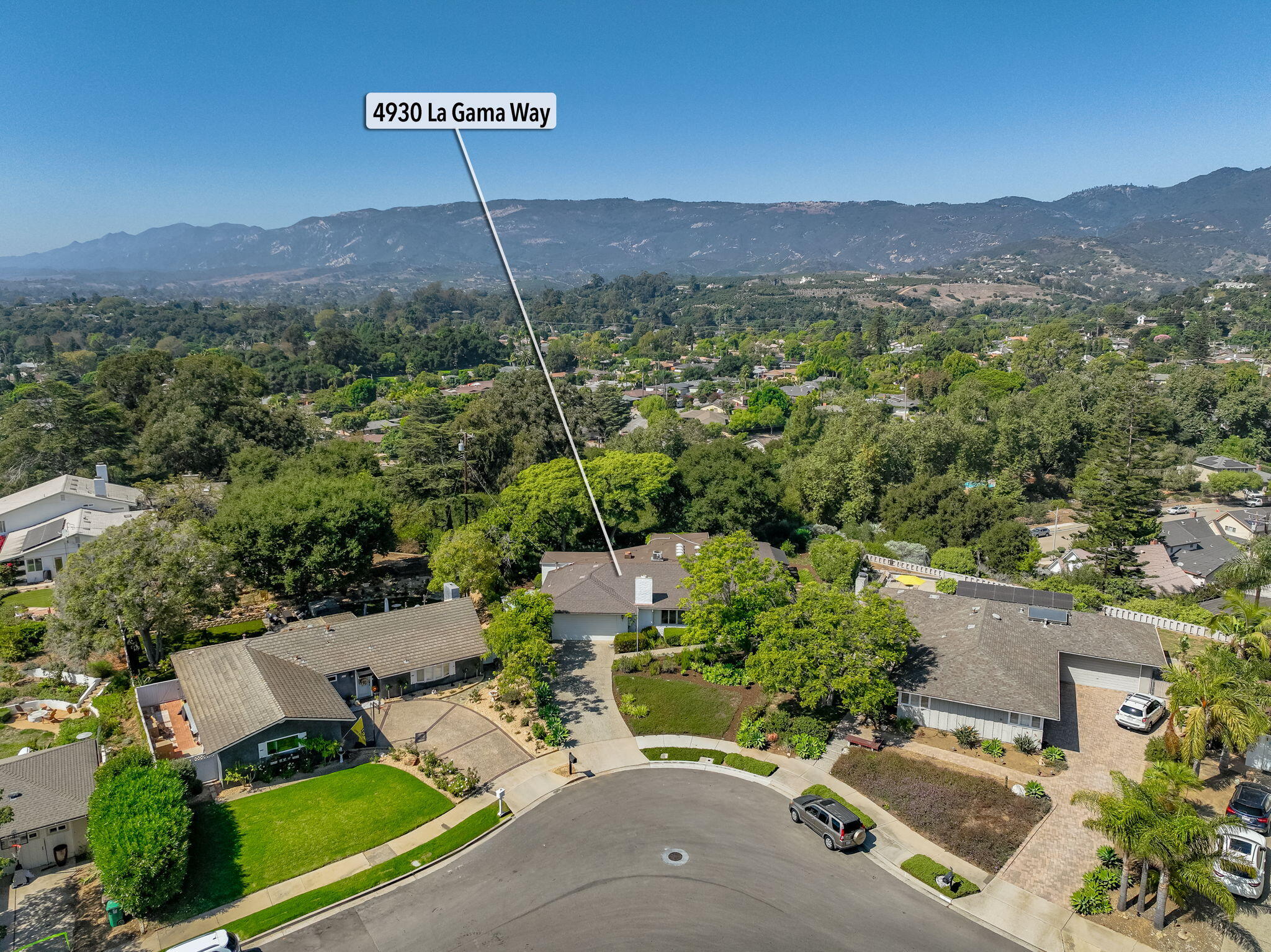 an aerial view of a house with a garden