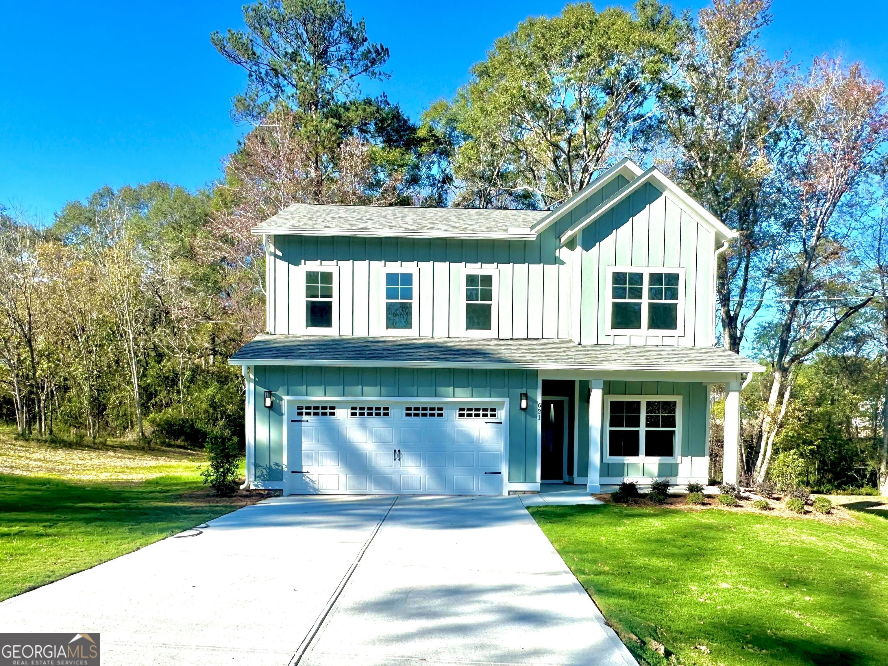 front view of a house with a yard