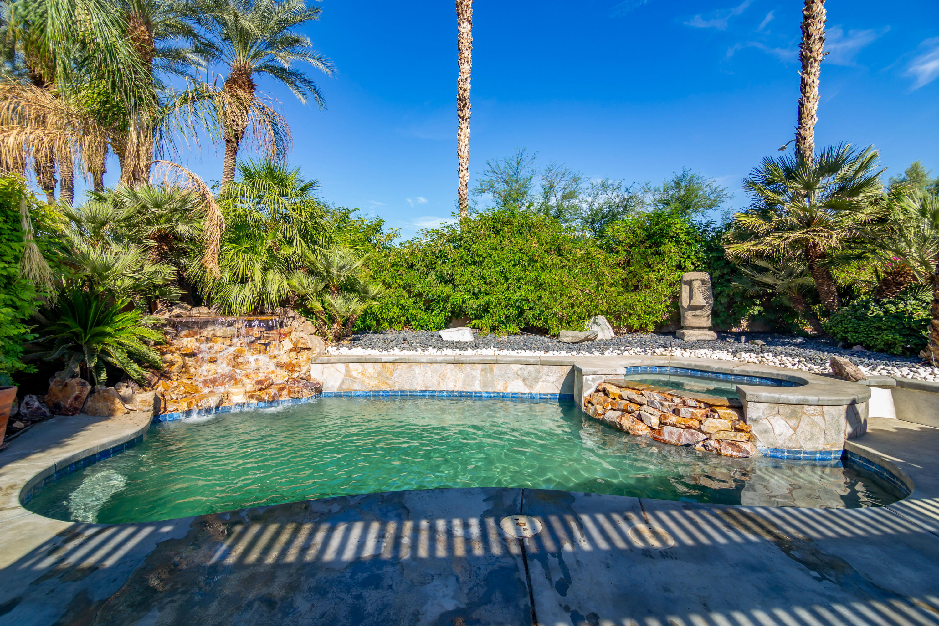 a view of a swimming pool with a patio