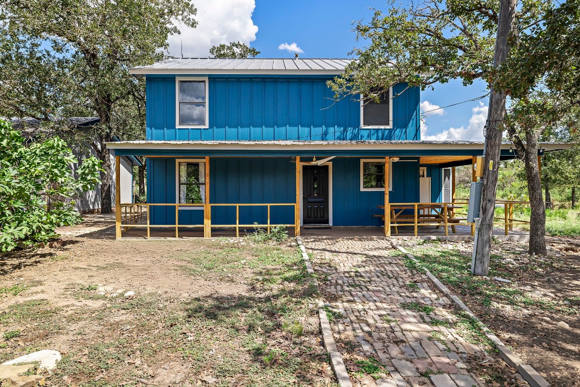 a house with trees in the background