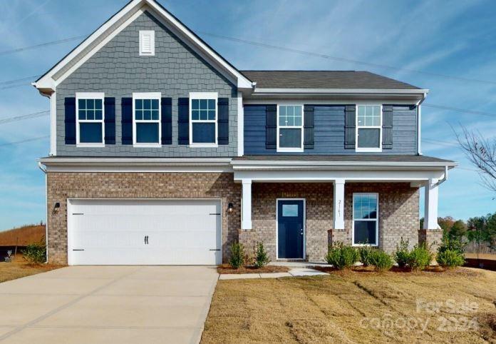 a front view of a house with yard