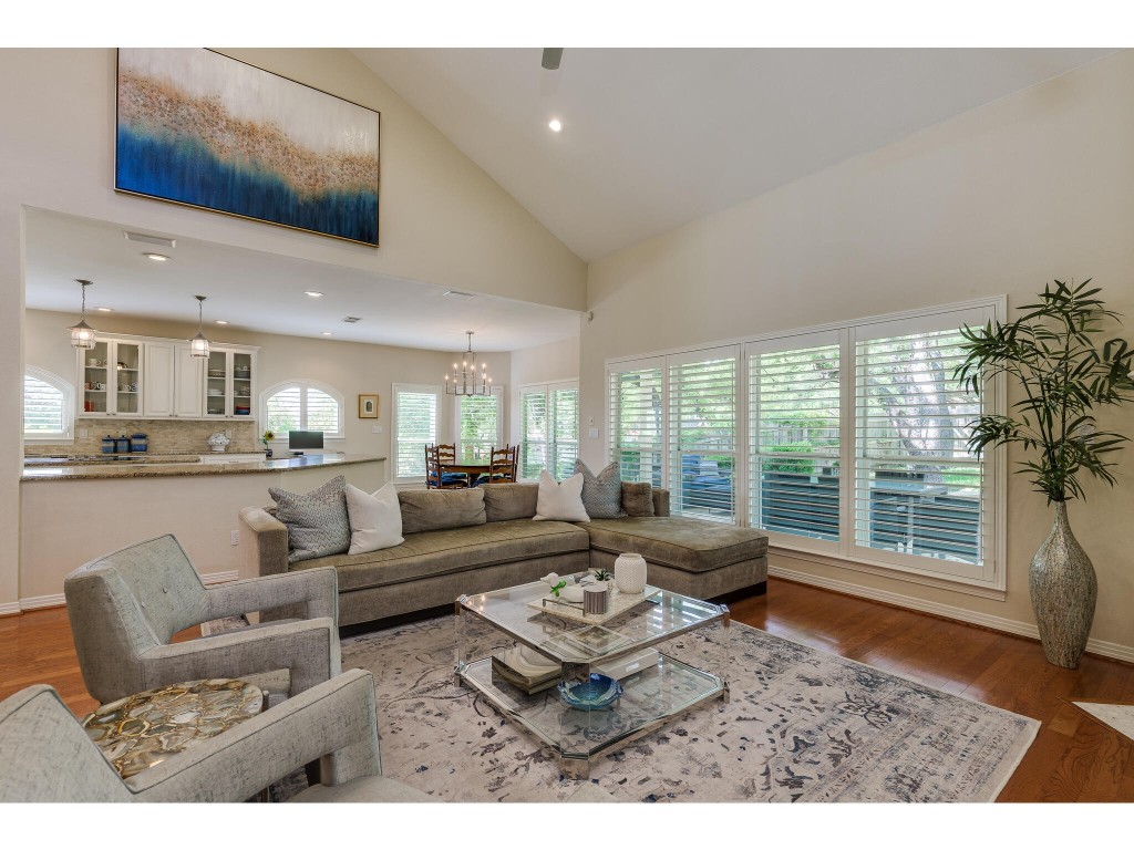 This photo gives you the perfect perspective of how many windows are in the living, breakfast, and kitchen areas.  All looking out to the beautiful park-like backyard and covered patio.