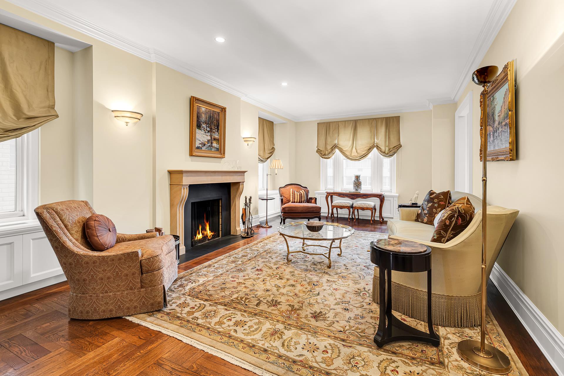 a living room with furniture rug and a fireplace