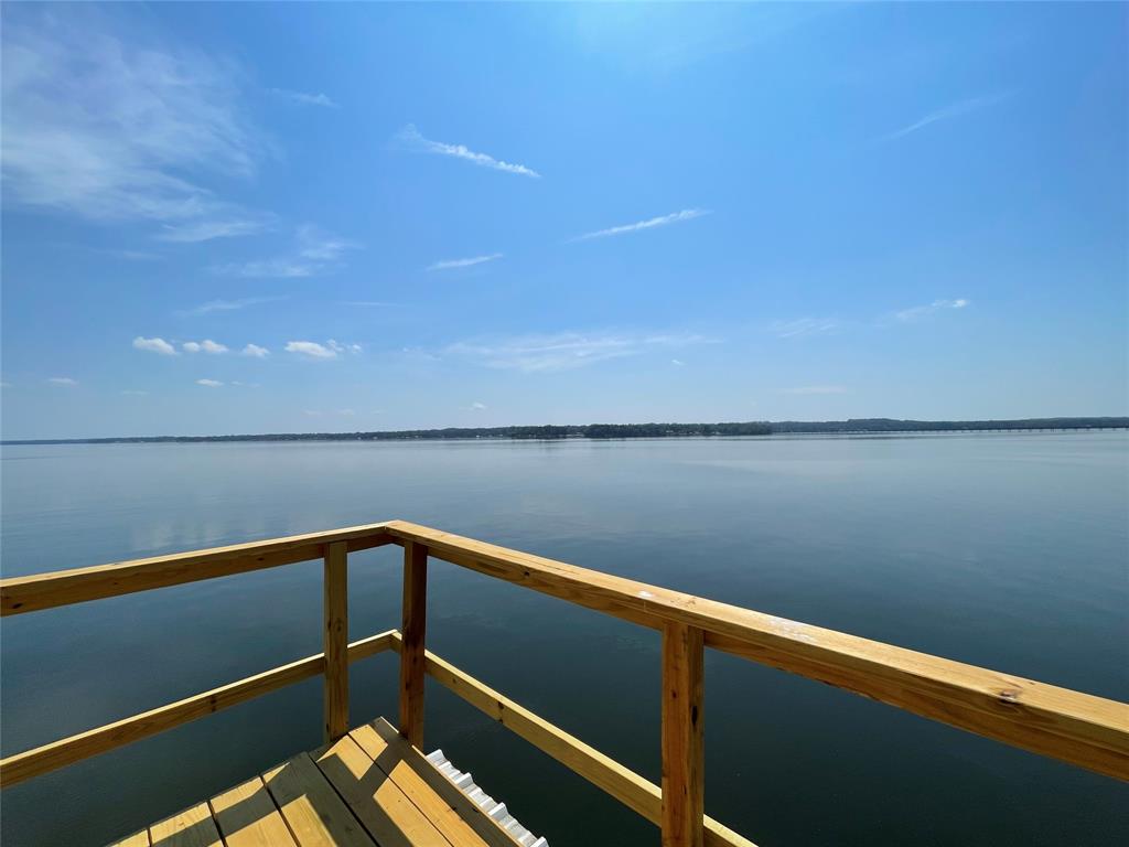 a view of wooden floor with a lake