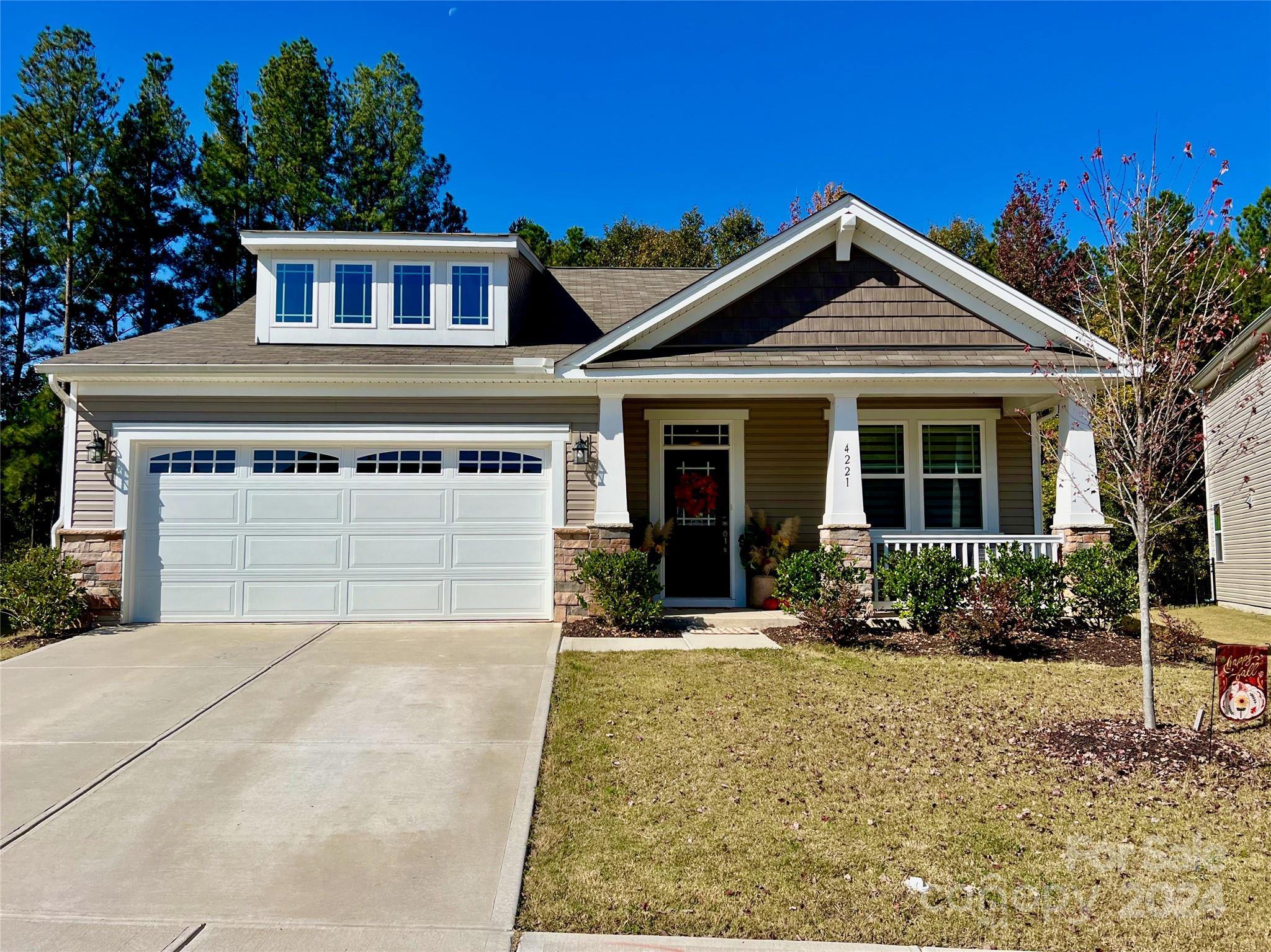 front view of a house with a yard