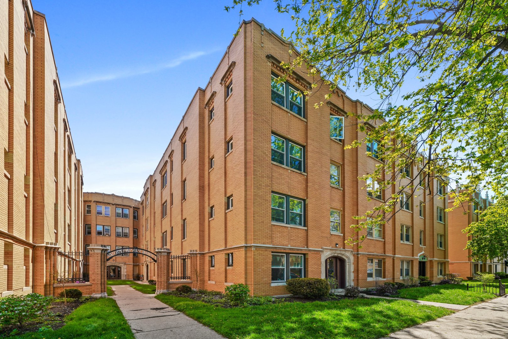 a view of a large building with a yard