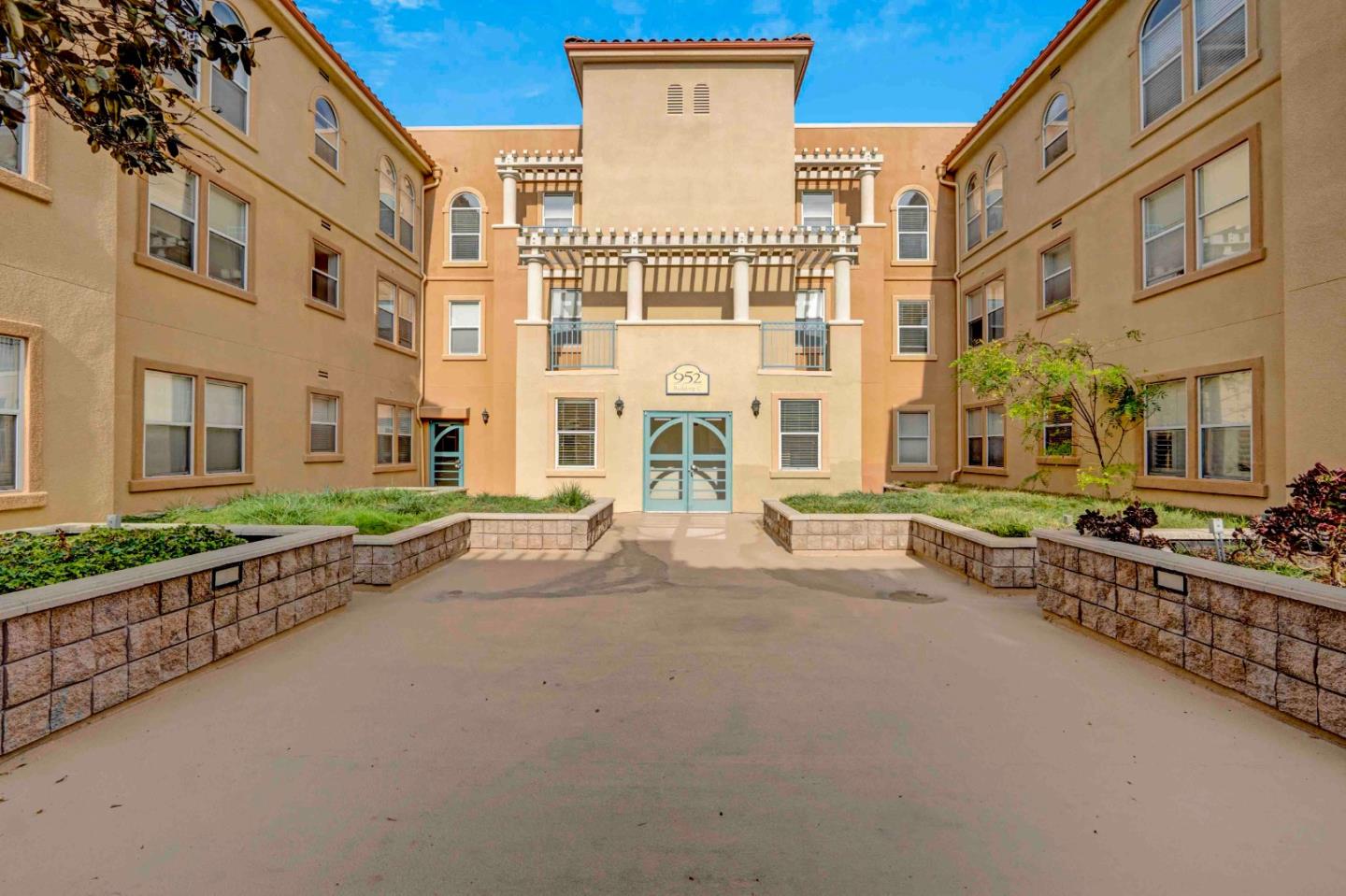 a multi story building with glass windows