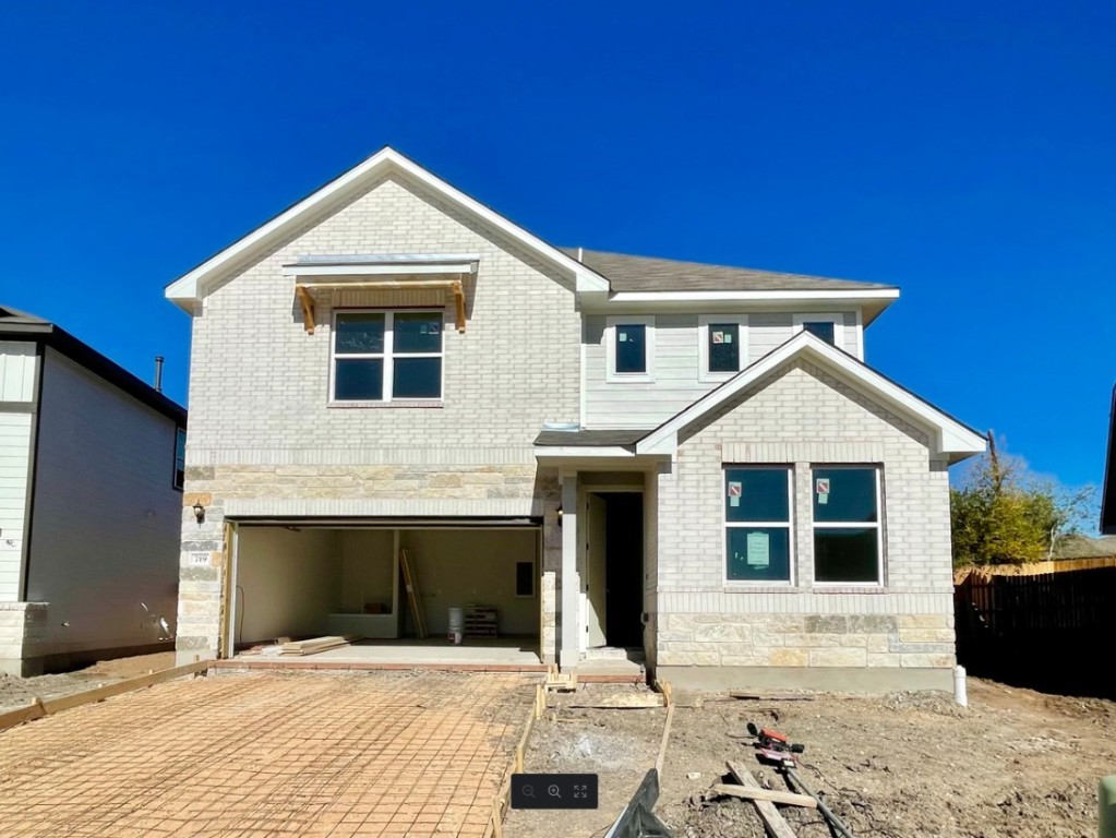 a front view of a house with yard