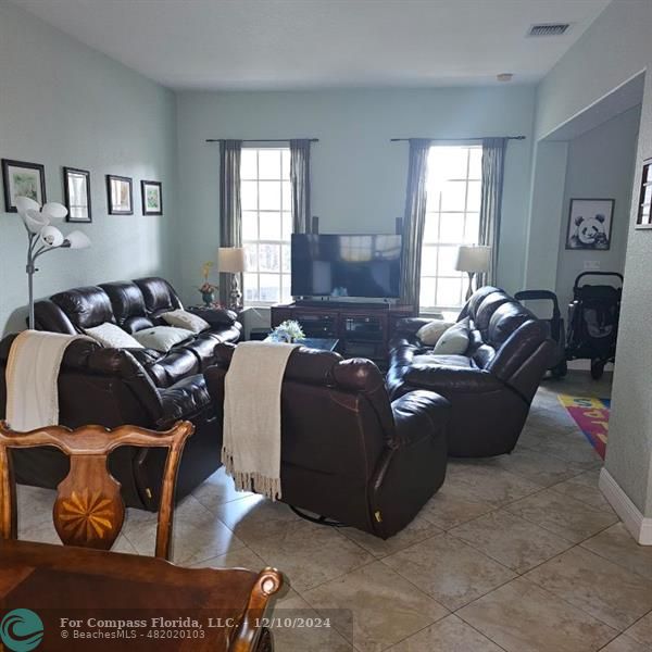 a living room with furniture and a window