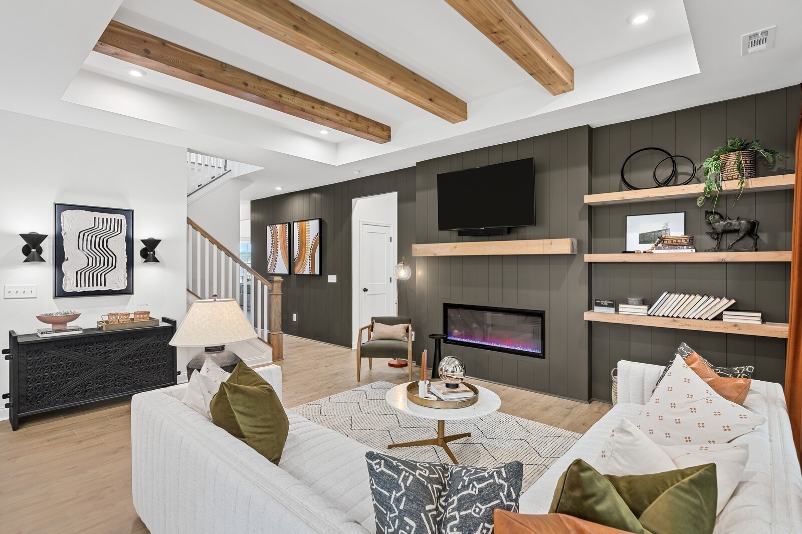 a living room with furniture fireplace and flat screen tv