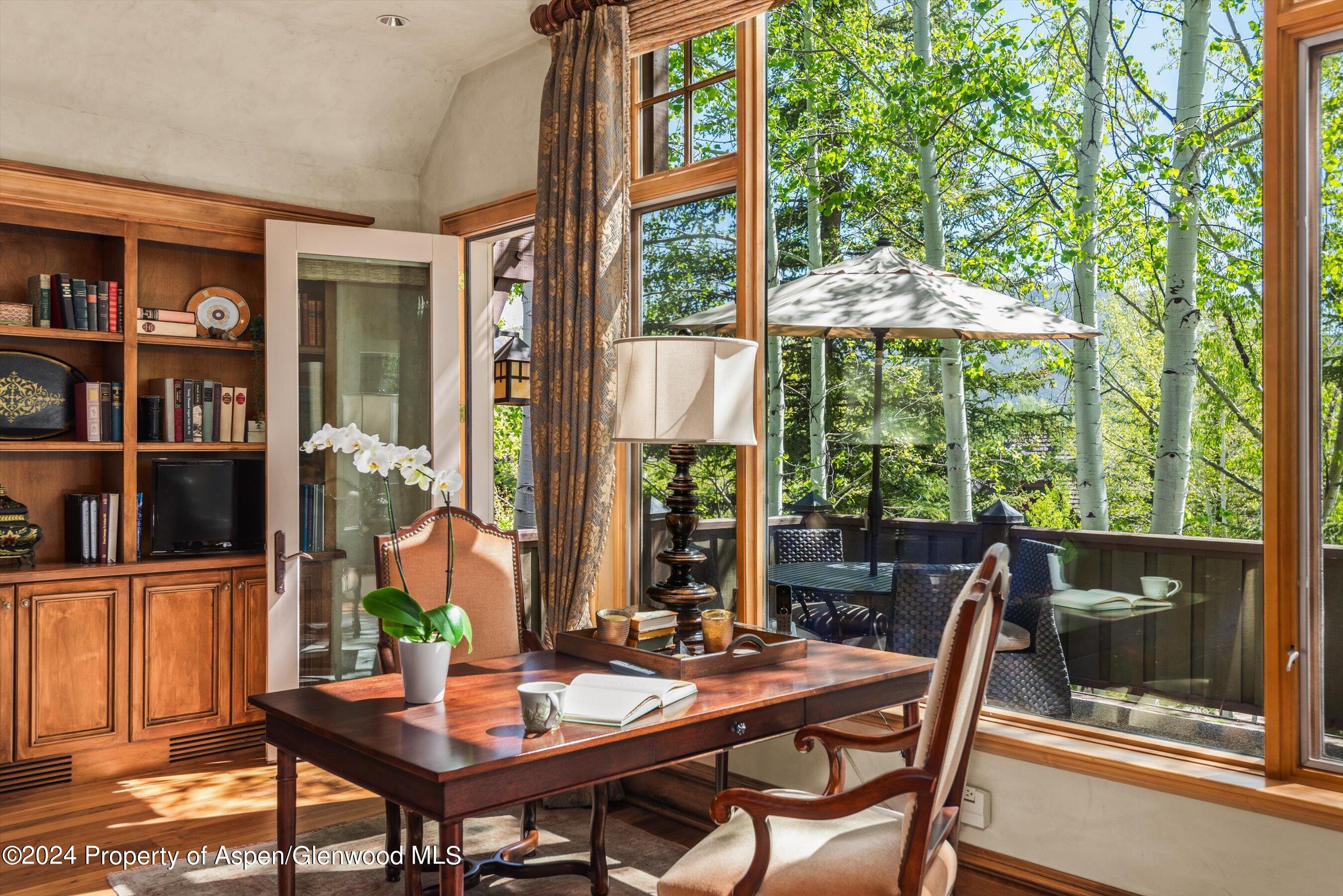 a view of a dining room with furniture window and outside view