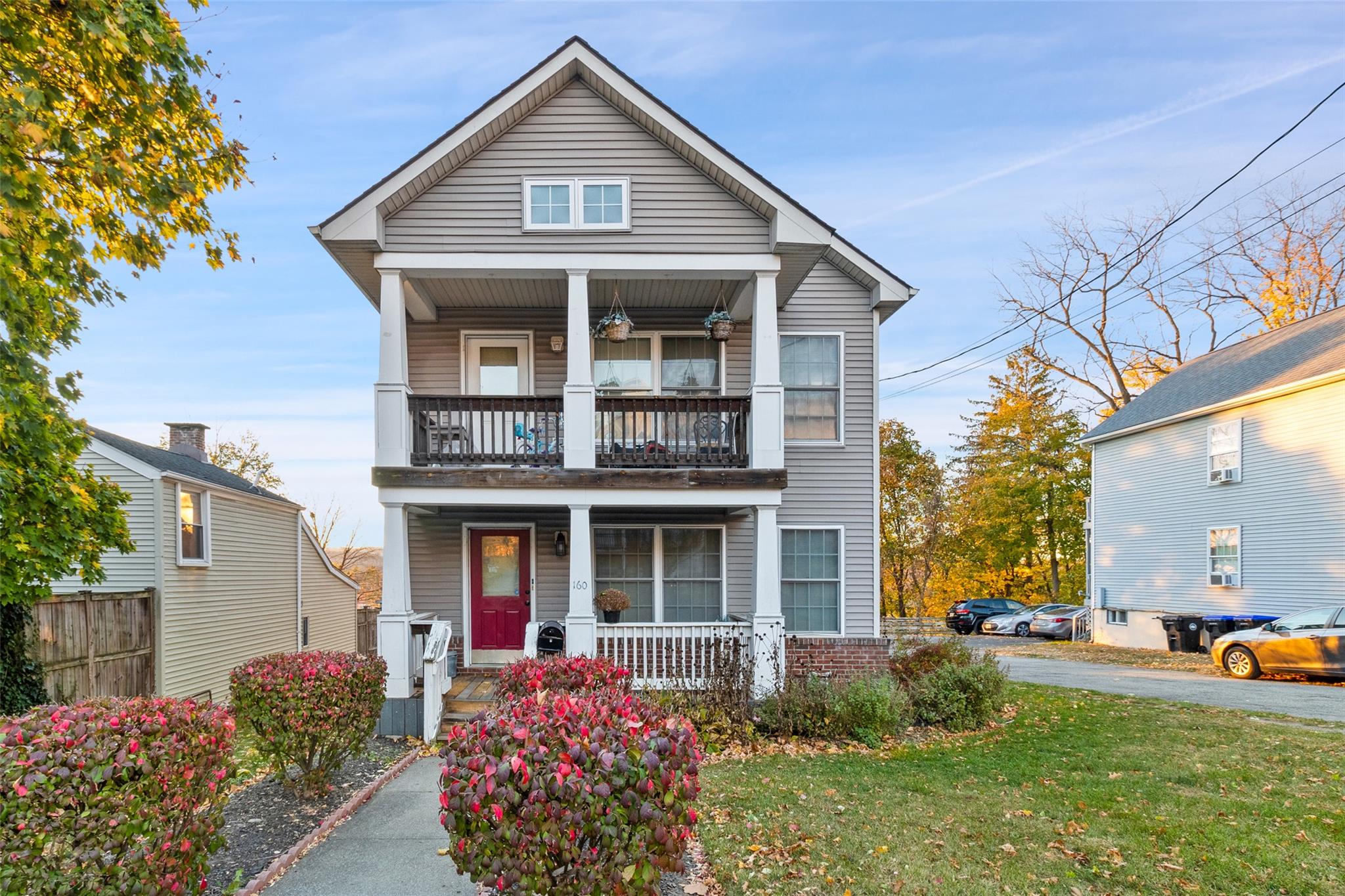 Front facade with a balcony and a front lawn