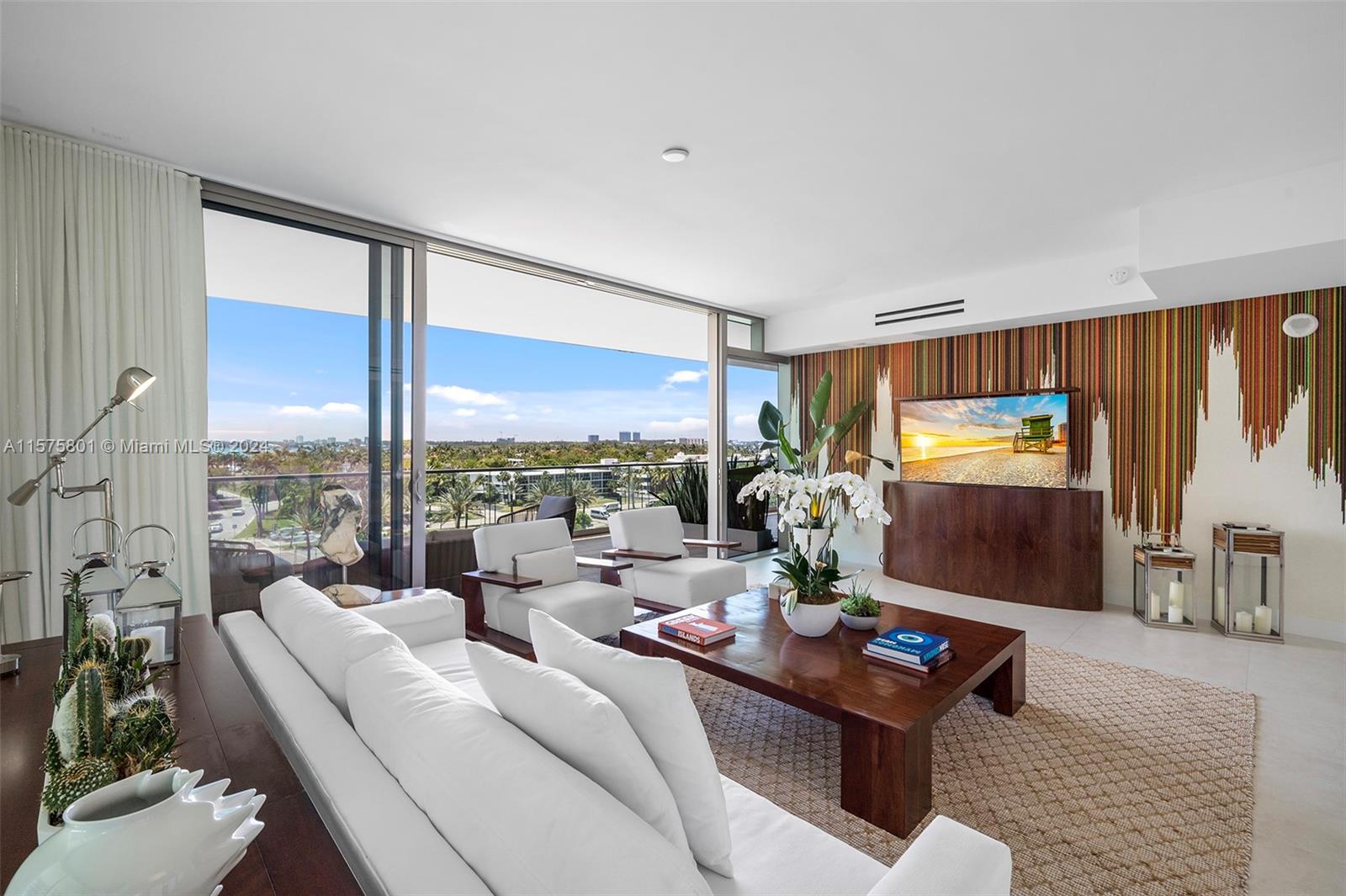 a living room with furniture a rug and a large window