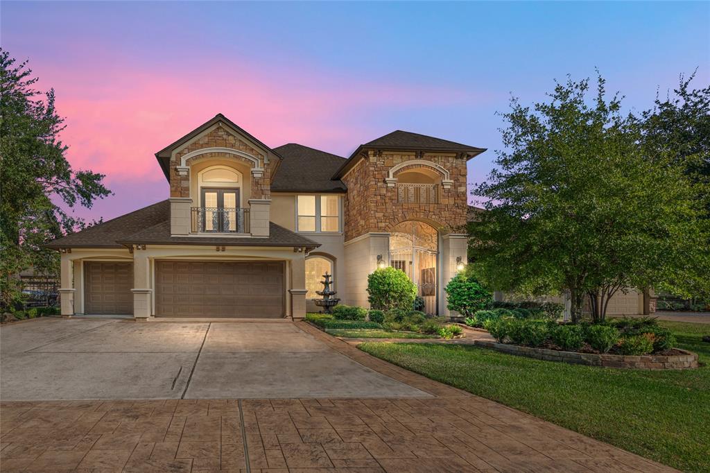 Welcome home to 6714 Augusta Pines Parkway E. Your spacious new two-story house has an attached three-car garage, a stone and stucco facade, grand arched entryway, and well-manicured landscaping.