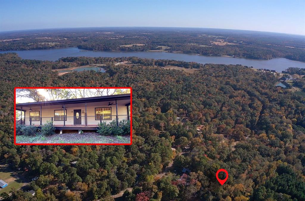 an aerial view of house with yard