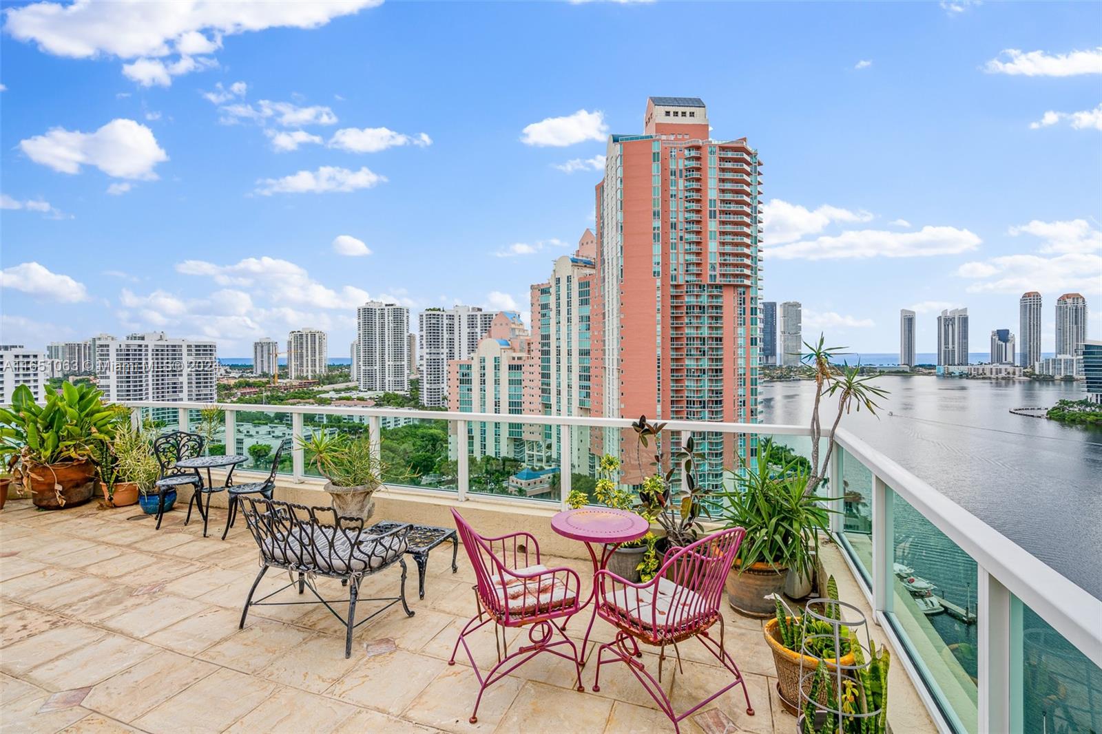 a view of a terrace with furniture and a view of lake