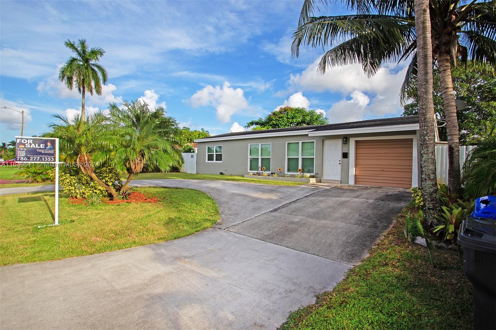 a house with palm tree in front of it