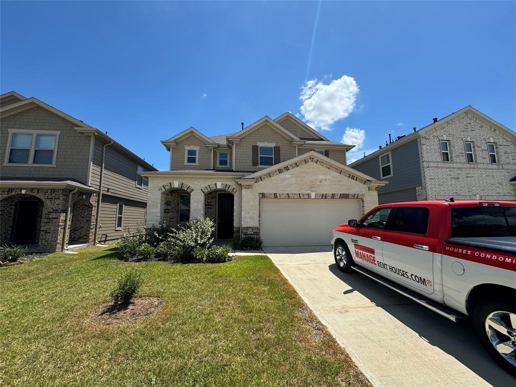 a front view of a house with a yard