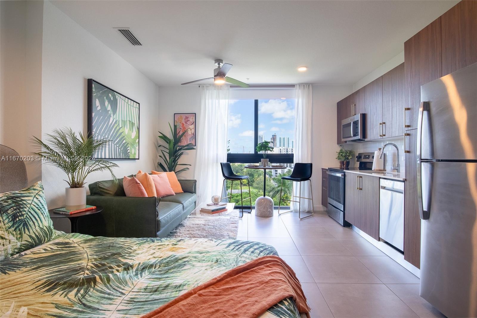 a living room with kitchen island furniture and a kitchen view