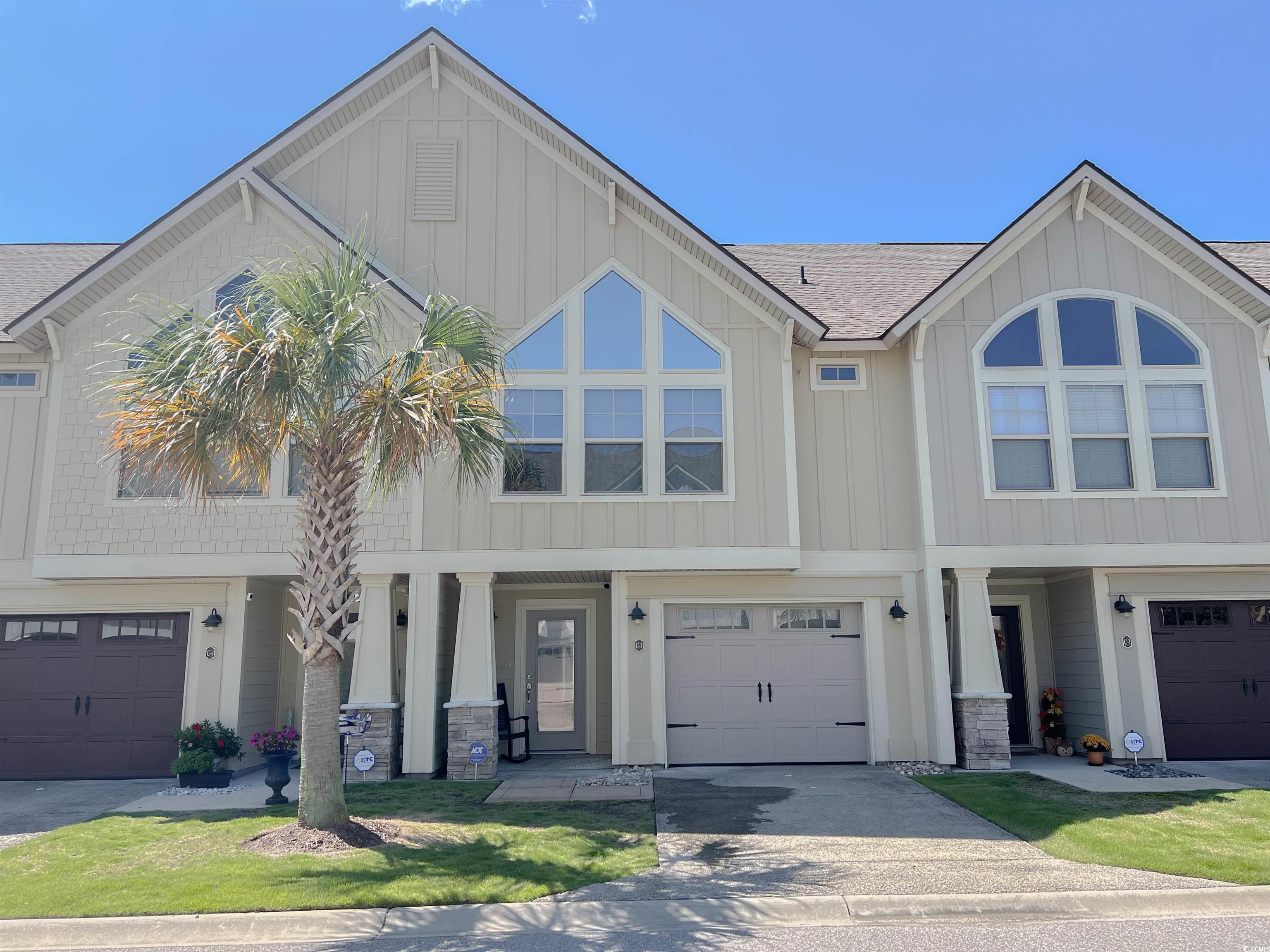 View of front of home featuring a garage