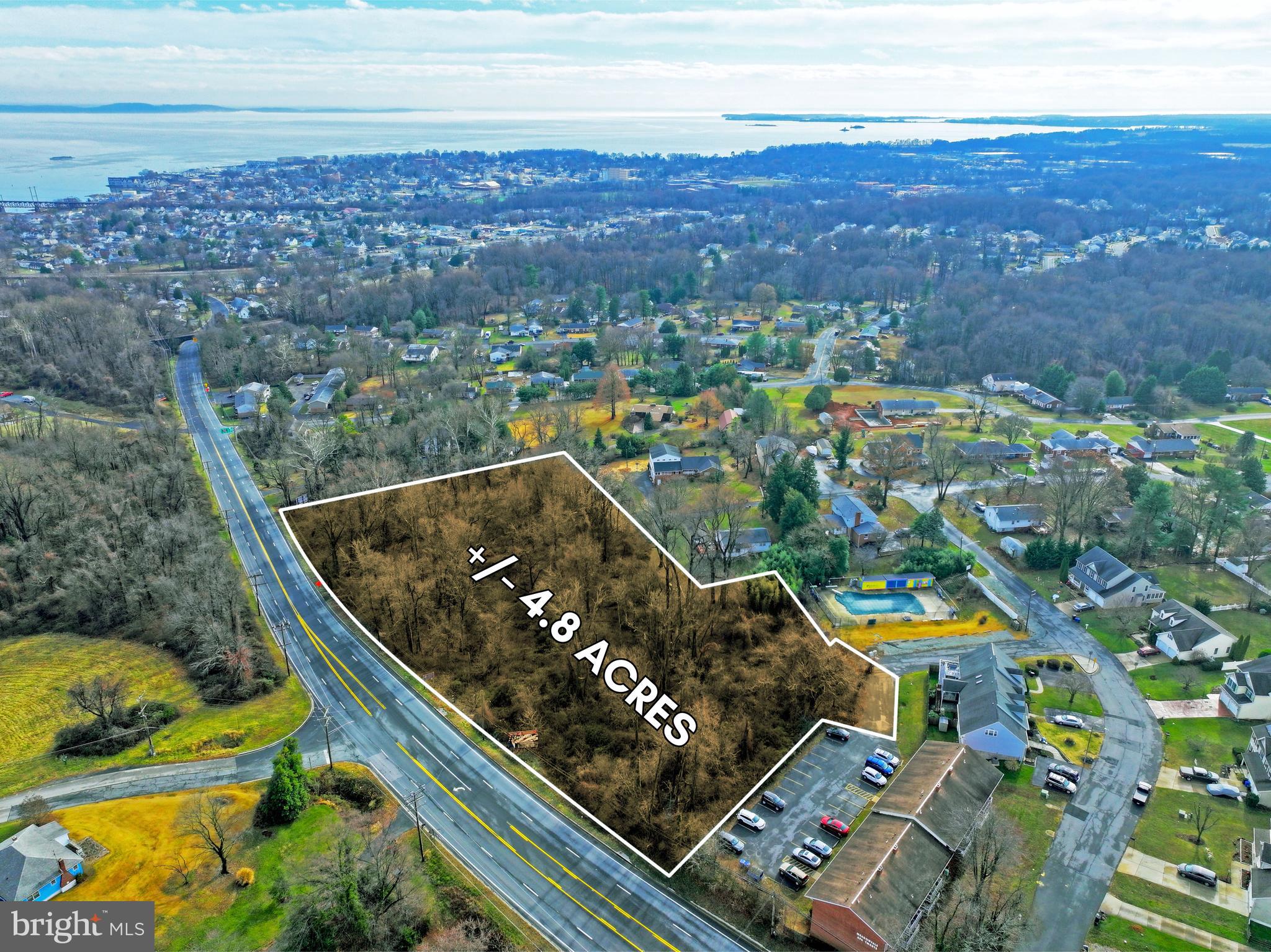 an aerial view of multiple houses with a yard