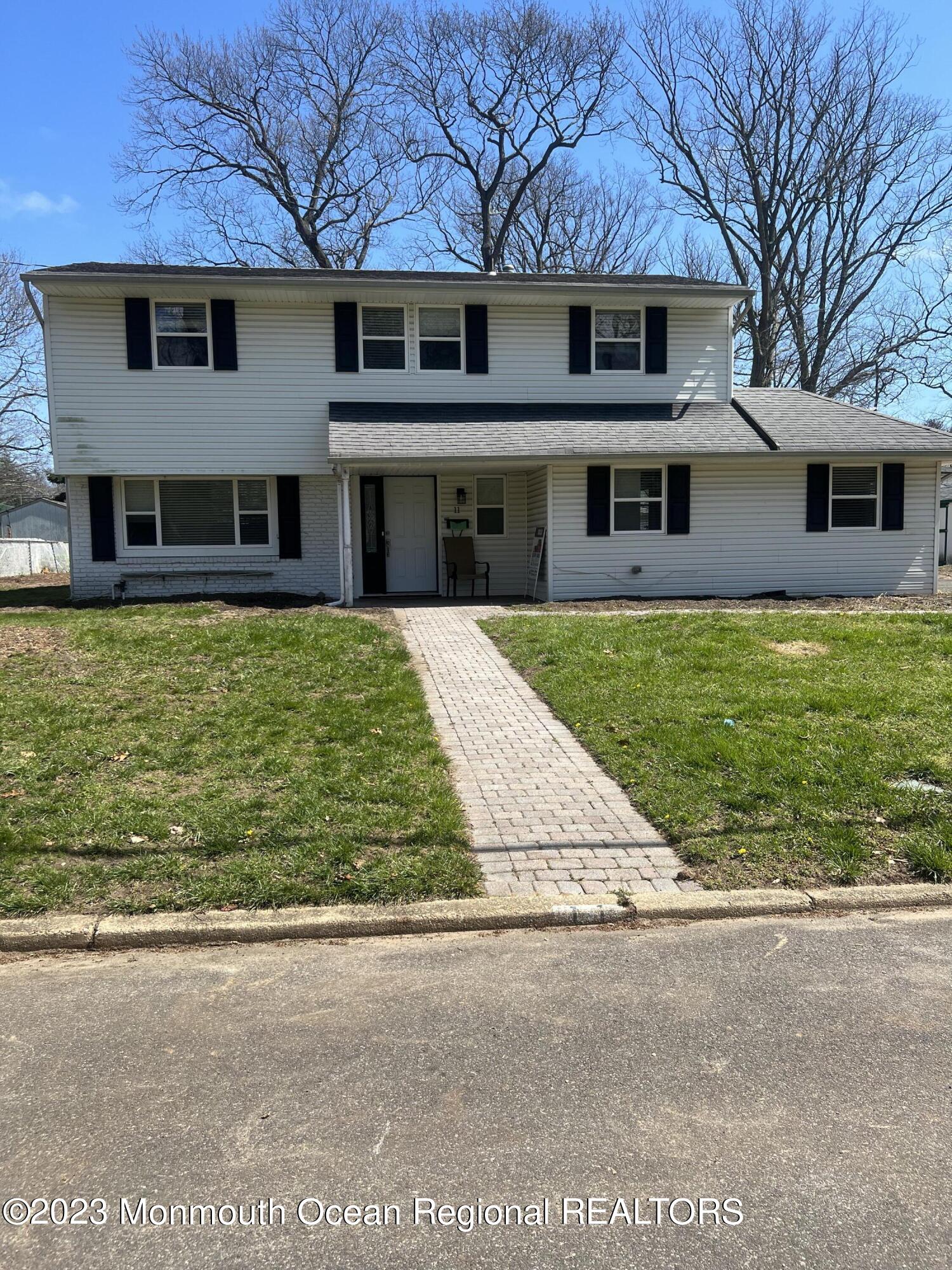 a front view of a house with a yard