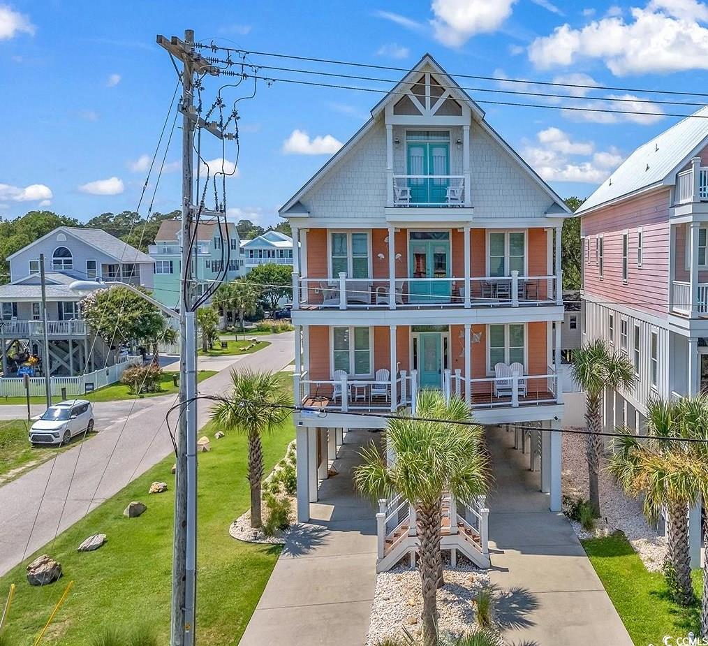 View of front of house with a balcony