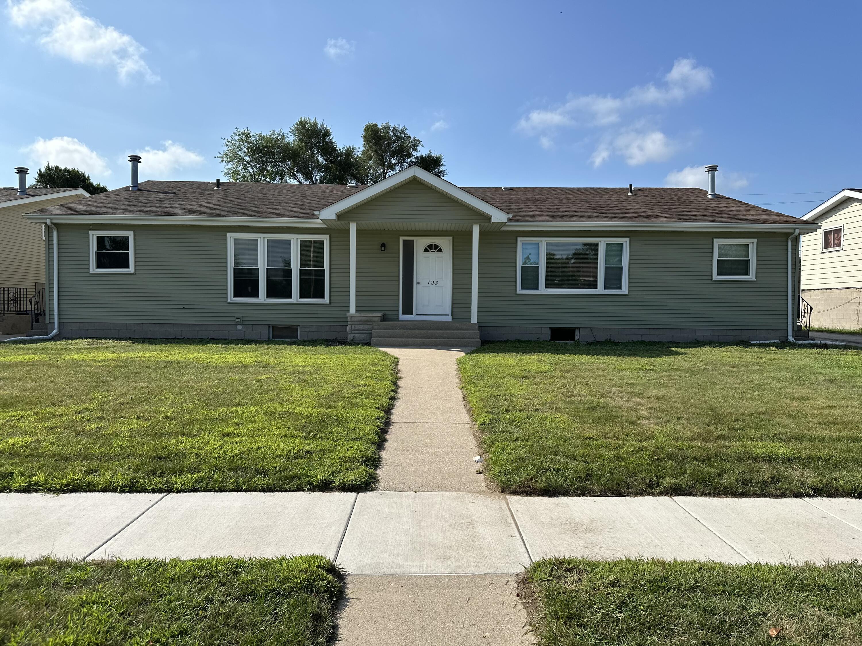 a view of house with yard