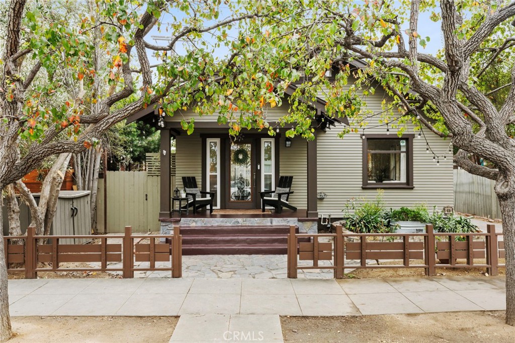 a building outdoor space with patio lots of furniture and plants