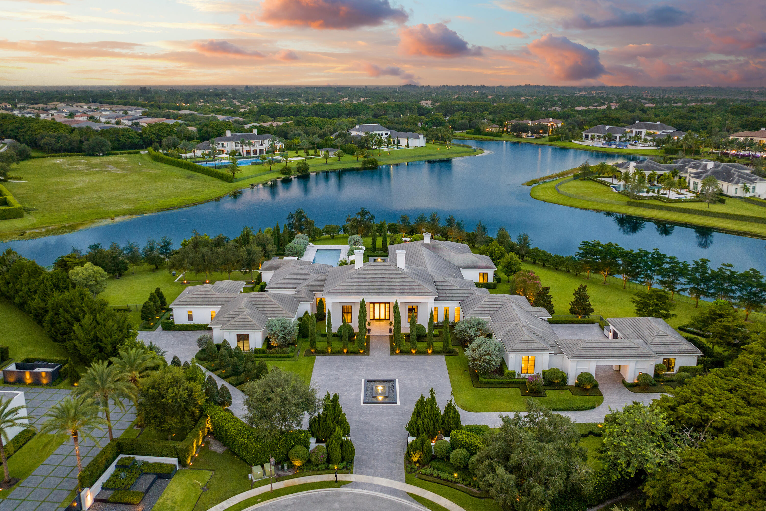 an aerial view of a city with lake view