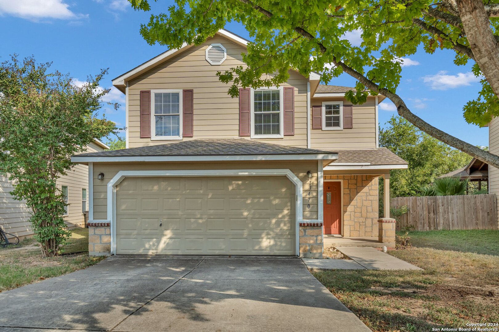 a front view of a house with a garage