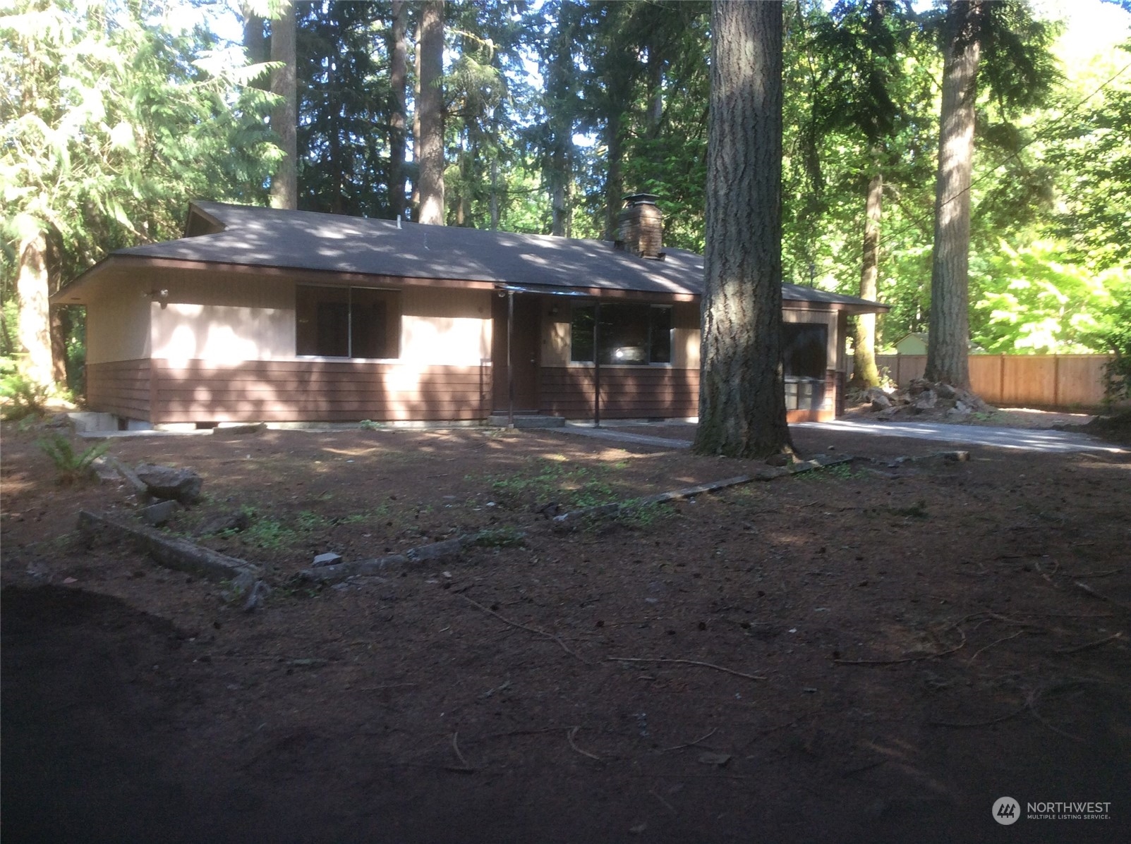 a view of a house with a tree