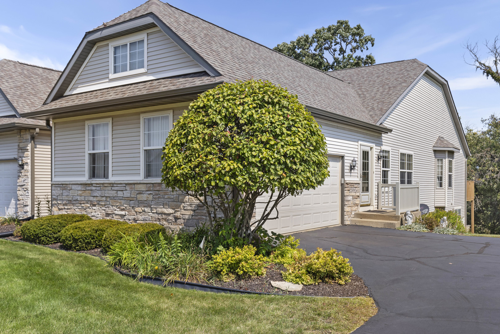 a front view of a house with a yard